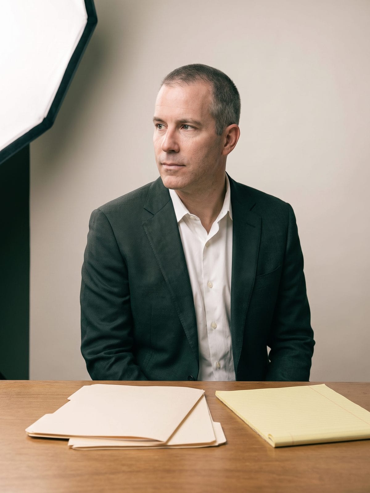 Ward Hollis at a table of case files